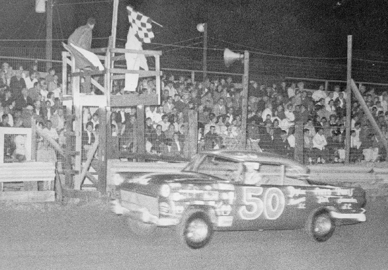 Slick Gibbons Takes Checkered Flag after winning race at Sumter Speedway.