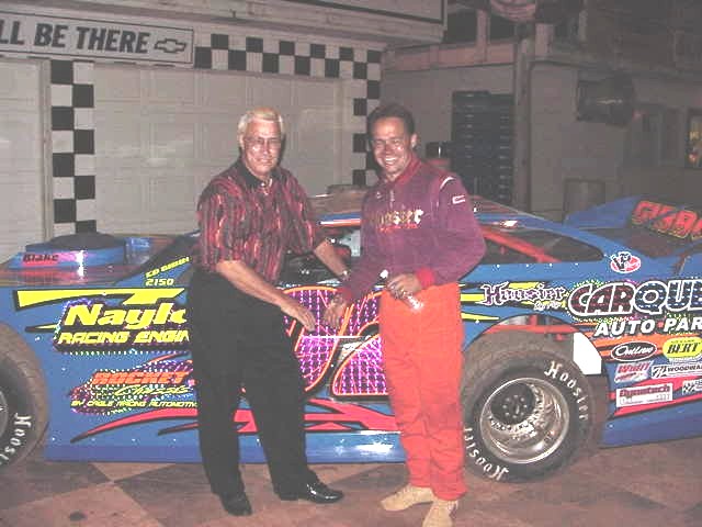 Slick Gibbons congratulates son Ed after winning super late model event at Sumter Speedway.