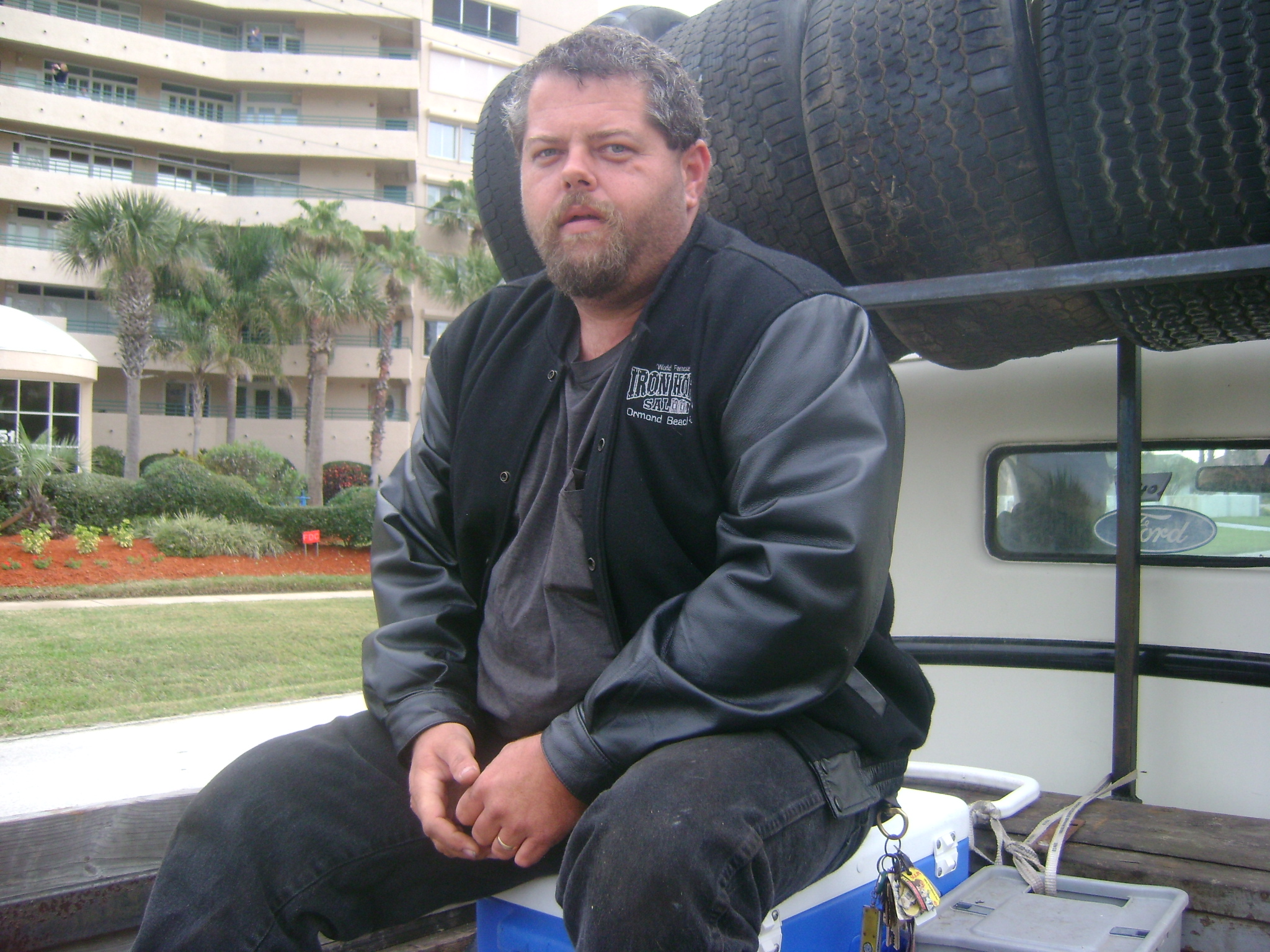 DEAN SITTING ON THE BACK OF THE OLD TRUCK