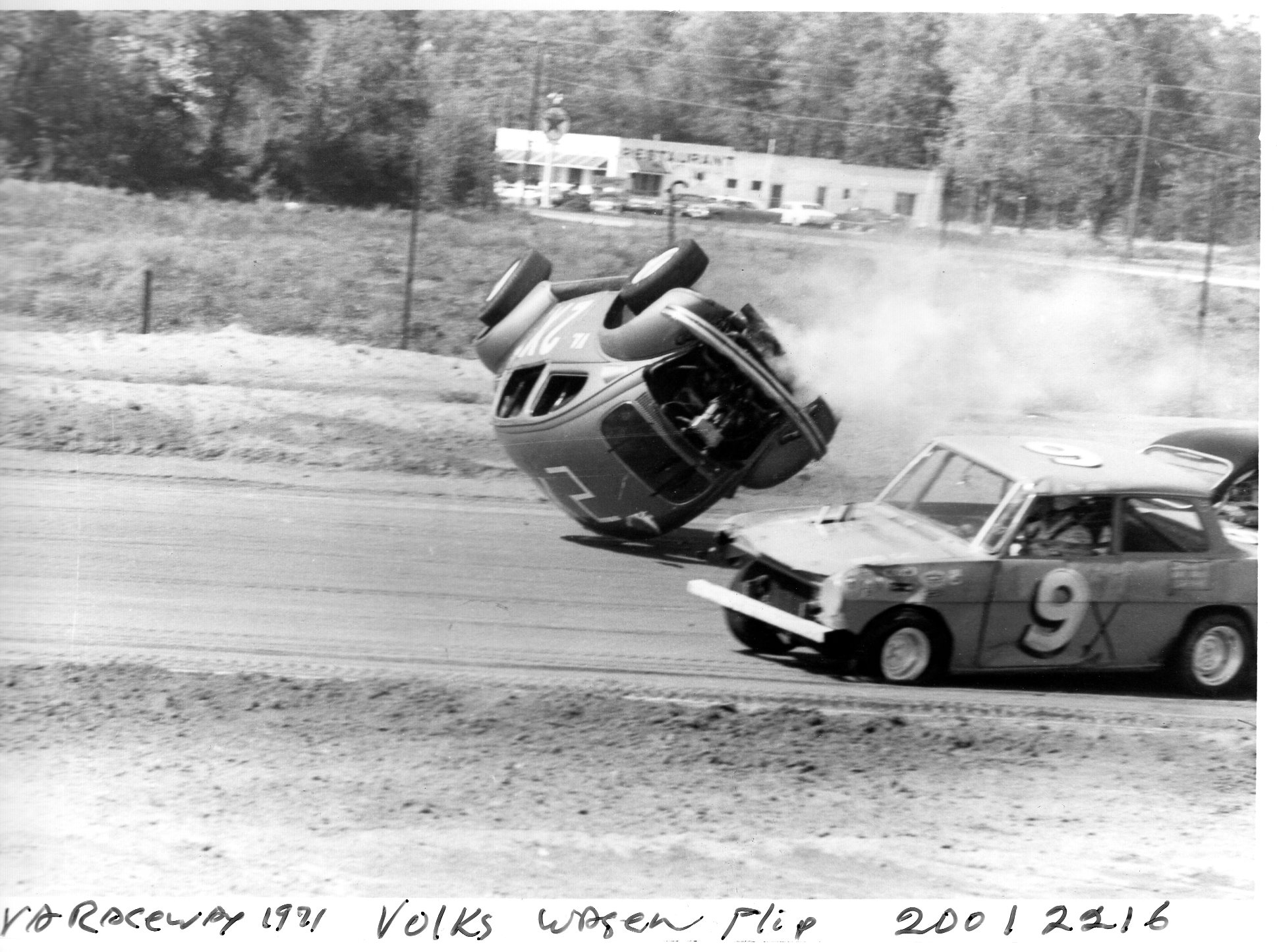 Jimmy Brill on his roof as Tom Ballos goes by at saluda early 70’s