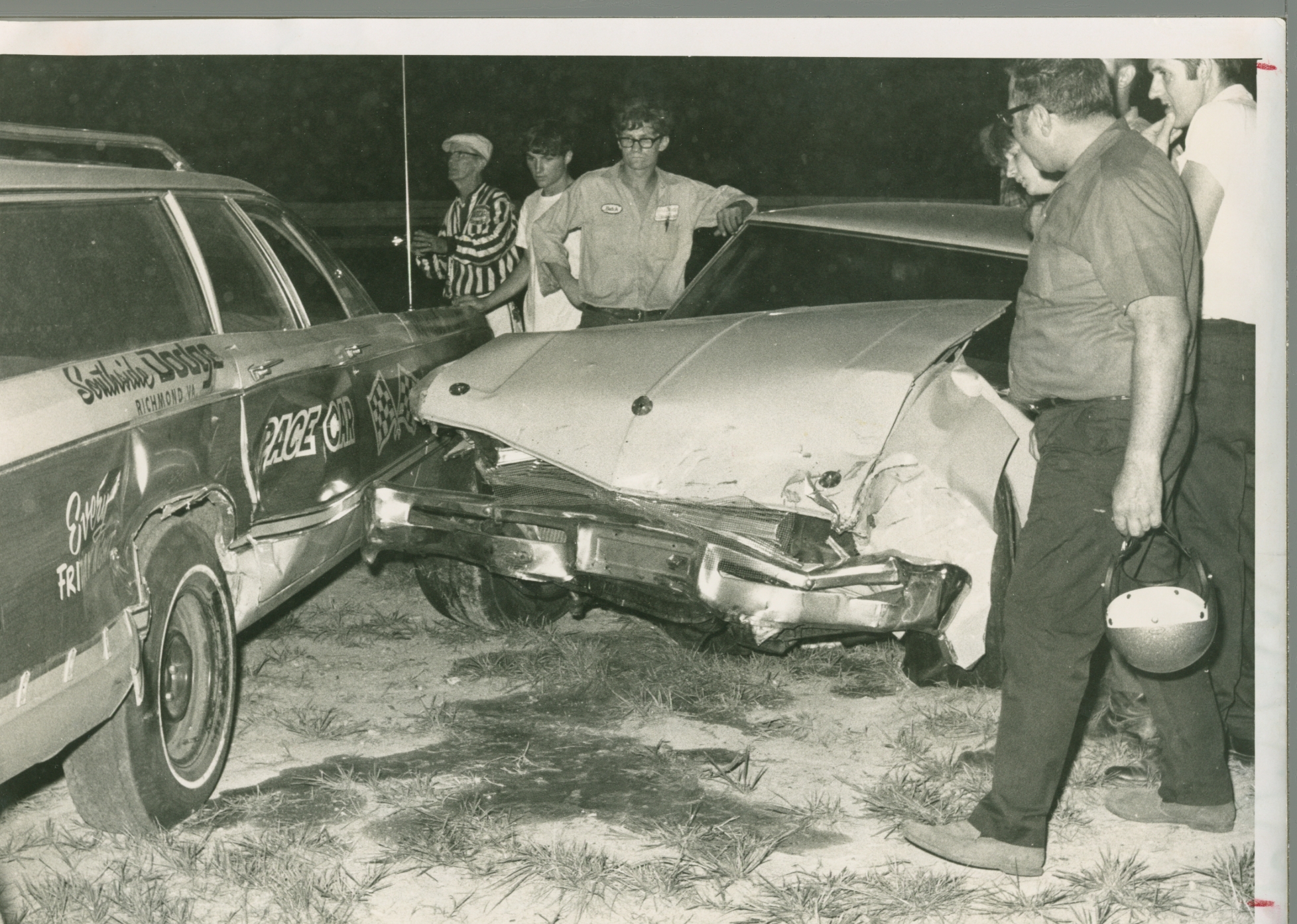 Butch Zervakis checking out the damage as Sonny Hutchins looks on