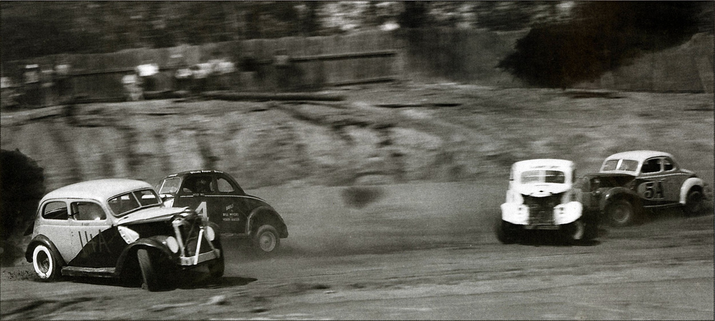 Fourth turn action at Peace Haven Speedway showing “Wild Bill” Myers in the Woody Hauser…